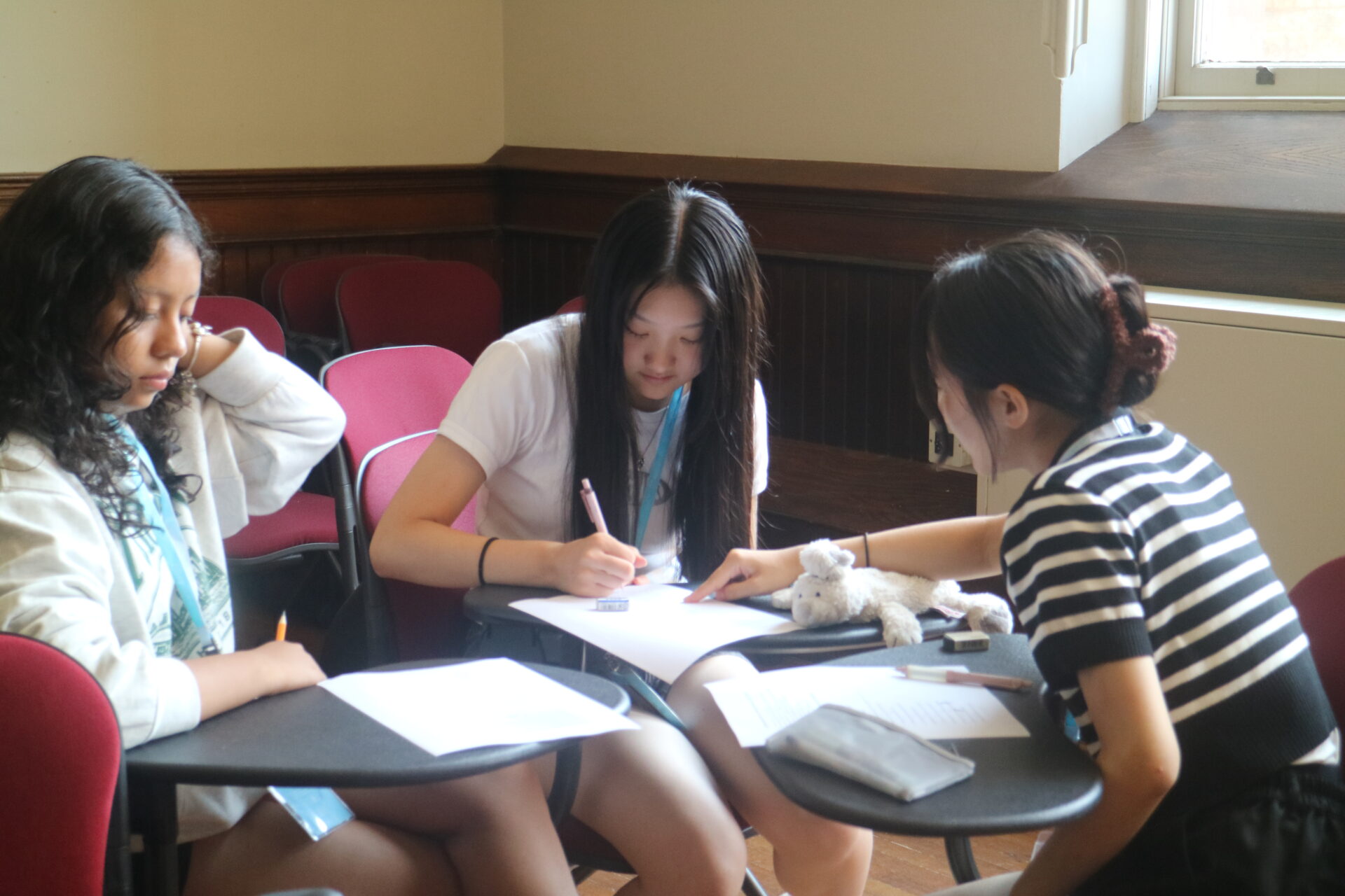 Student focusing on solving a problem in class