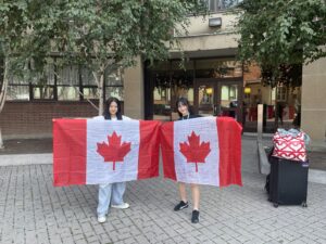 Junior study abroad participant with Canadian flag full of messages